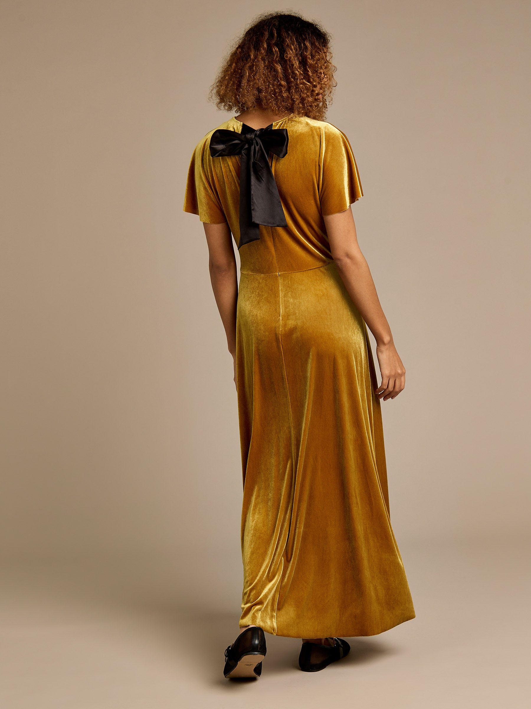 Hallie Gold Velvet Maxi Dress with Black Bow Detail